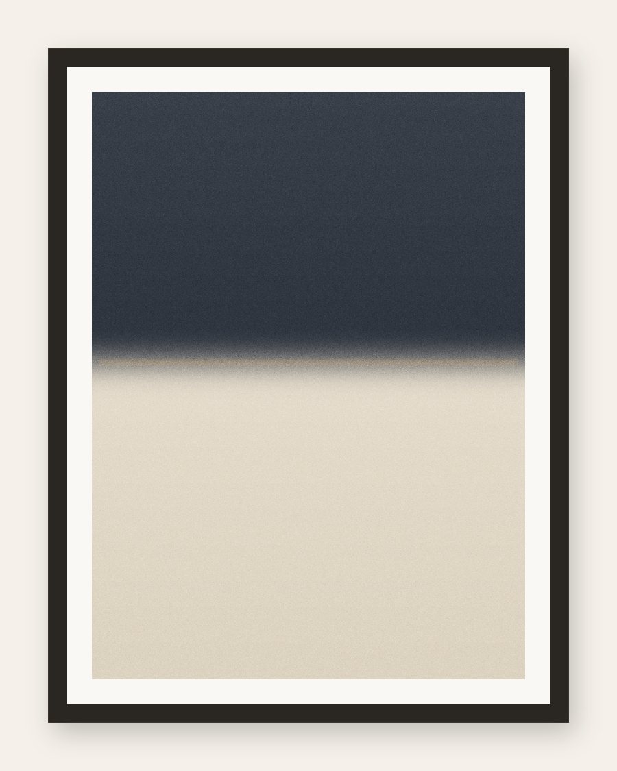 Framed charcoal-over-cream horizon with a muted gold line, charcoal frame and cream mat