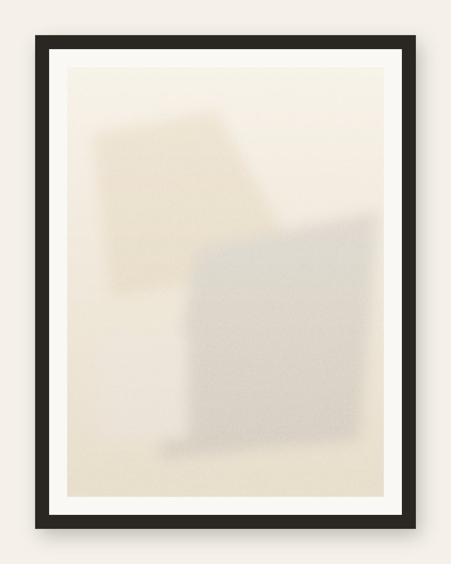 Framed cream field with soft geometric planes, charcoal frame and cream mat
